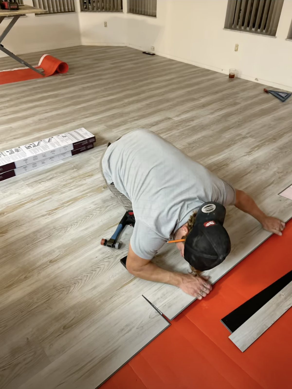 Luxury vinyl plank flooring mid-install by NoBull Man
